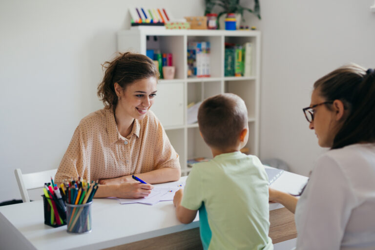 boy having conversation with psychologist for enrollment in school